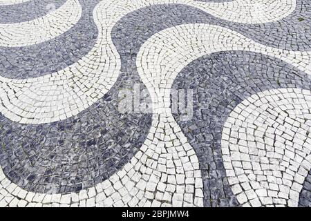 Typical stone floor Lisbon, detail of a typical floor with shapes and drawings, art Portugal, tourism Stock Photo