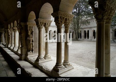 The cloister and courtyard of Church of St.Trophime aka Cathedrale Saint-Trophime d'Arles.Arles.Bouhes-du-Rhone.Alpes-Cote d'Azur.France Stock Photo