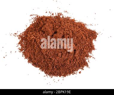 top view of handful of freshly ground coffee isolated on white background Stock Photo