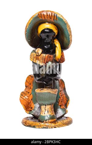 Dolls from the Dominican Republic. A traditional souvenir made from ceramic are colorful painted dolls without face. The ceramic figure isolated on a Stock Photo