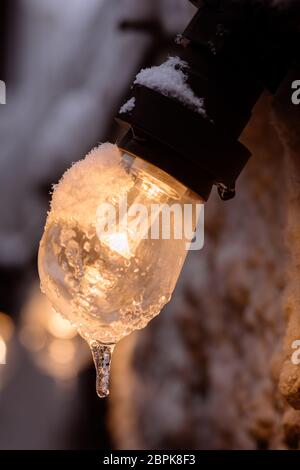 Color image of a frozen lit light bulb. Stock Photo