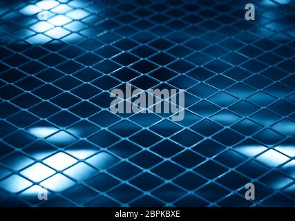 Rabitz fence at jail bokeh background Stock Photo