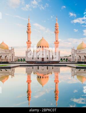 Public White Mosque with Domes and Minarets in the historic hill-fort Bulgar, Russia. Operates exclusively as places of worship. Stock Photo