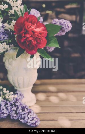 Bouquet with lilac and peony roses Stock Photo