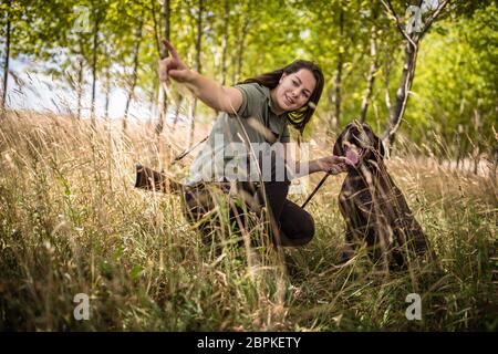 Autumn hunting season. Hunting. Outdoor sports. Woman hunter in the woods Stock Photo