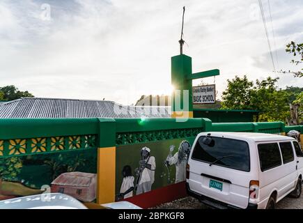 Nine Mile, Jamaica JANUARY 07, 2017: Private basic school opened by Cedella Marley Booker - Bob Marley's sister. The wall in Marley colors Stock Photo