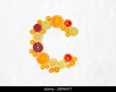 the letter C shaped with different slices of healthy fruits Stock Photo