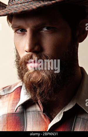 Young handsome man in a cowboy hat Stock Photo