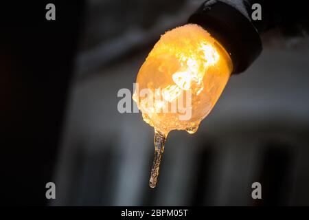 Color image of a frozen lit light bulb. Stock Photo