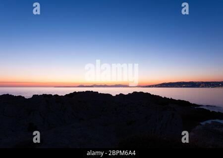 Sunset from Cap d'Antibes, France. Cannes coastline view. Beautiful french landscape Stock Photo