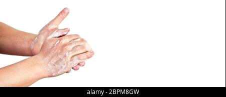 Young man wash hands with soap, closeup detail on soap bubbles, isolated on white, empty space for text right side. Can be used during coronavirus cov Stock Photo