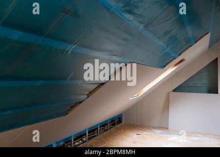 House attic insulation and renovation. Drywall construction Stock Photo