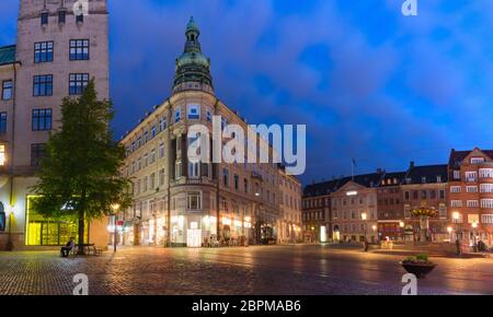 Panorama of oldest square Gammeltorv or Old Market in Old town during morning blue hour, Copenhagen, capital of Denmark Stock Photo