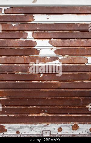 Old rusty garage shutter. Ideal for concepts and backgrounds. Stock Photo