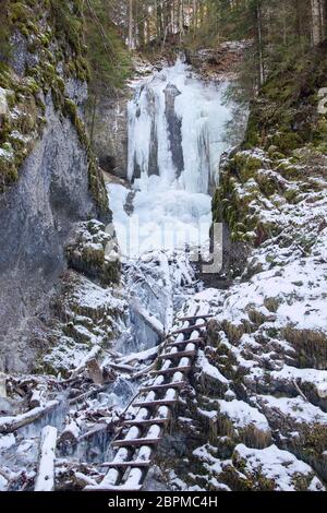 Vysny waterfall in Falcon valley in National park Slovak Paradise in winter Stock Photo