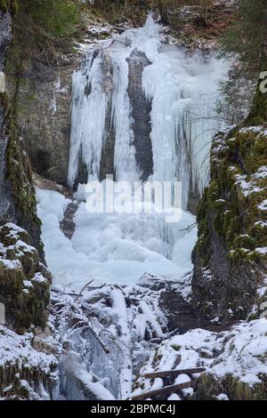 Vysny waterfall in Falcon valley in National park Slovak Paradise in winter Stock Photo