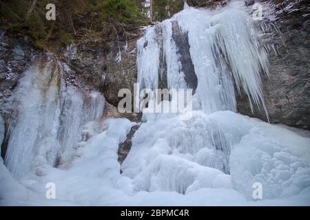 Vysny waterfall in Falcon valley in National park Slovak Paradise in winter Stock Photo