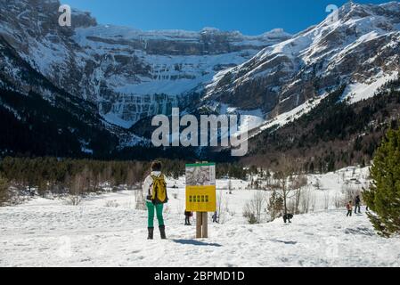 a woman hiker in the Cirque of Gavarnie, France Stock Photo