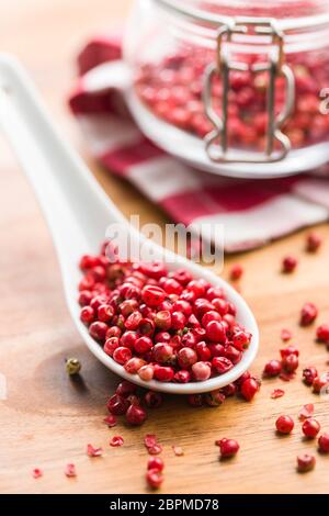 Dried pink peppercorn in spoon. Stock Photo