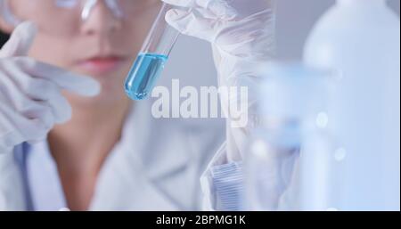 Scientists researching in laboratory Stock Photo