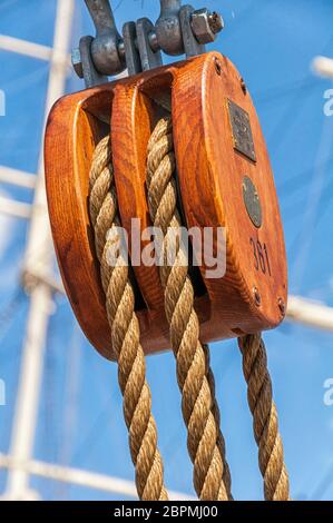 Double block with rope on a sailing ship Stock Photo - Alamy