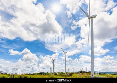 Beautiful landscape many windmills under the sun on blue sky and clouds background, Clean energy that is environmentally friendly at Khao Kho, Phetcha Stock Photo