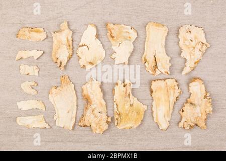 Dong quai, traditional chinese medicine. Angelica roots on white background. Medical herb. Stock Photo