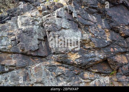 a grey rock face in the sun Stock Photo