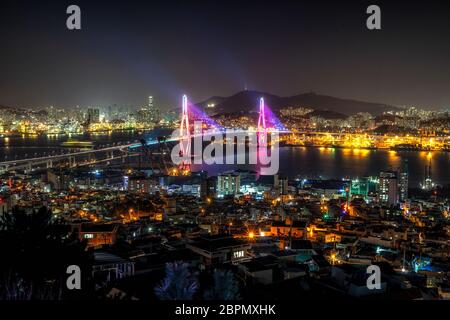 Busan harbor bridge is one of famous bridges in south korea. Connecting Yeongdo and Nam district, the bridge lits up at night in different colors. Tak Stock Photo