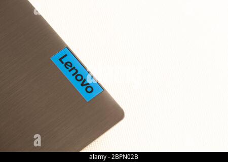 Back side of laptop with lenovo logo isolated on white background Stock Photo