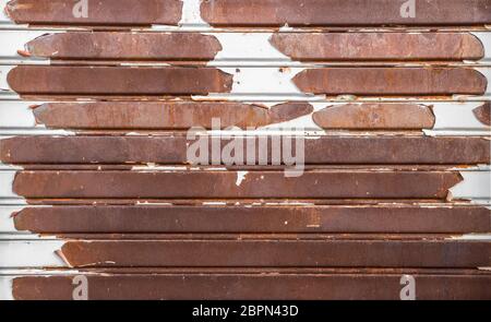 Old rusty garage shutter. Ideal for concepts and backgrounds. Stock Photo