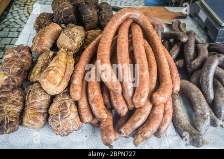 Delicious meat and blood sausages for sale from a street stand during the annual Bread and Gingerbread Festival in Jawor, Poland Stock Photo