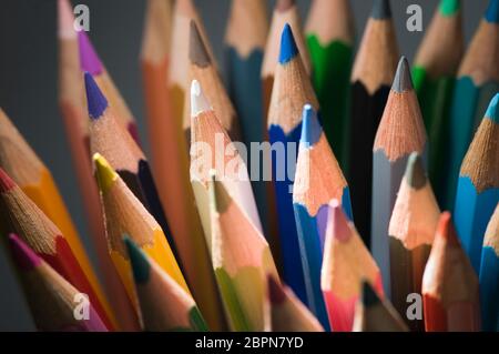 Close-up of vertical crayons in the hard sidelight. Stock Photo