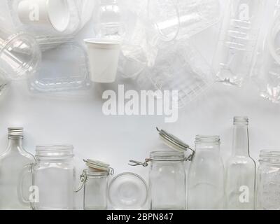 many different empty glass and plastic bottles lying on a white background Stock Photo