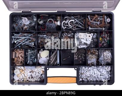 Plastic box full of old bolts, nails and other stuff, different condition and size Stock Photo