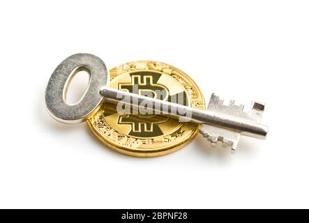 Bitcoin and safe key isolated on white background. Stock Photo