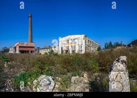Old abandoned industrial factory Krayan in Odessa, Ukraine, in a sunny summer day Stock Photo