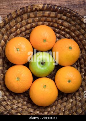 Fresh fruit basket with apples and oranges Stock Photo