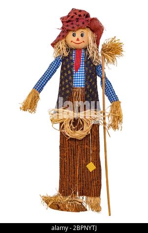 Straw decorations background. Close-up of a funny handmade scarecrow doll isolated on white background. Straw dolls for thanksgiving in autumn. Macro. Stock Photo