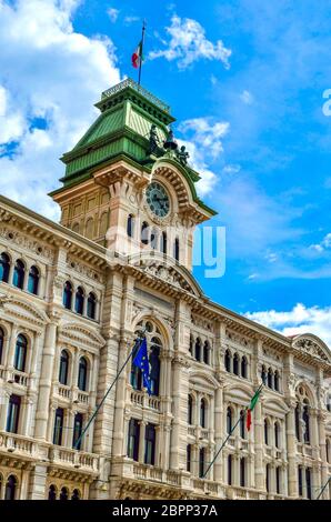 Municipio clock tower building of Trieste in Piazza Unita Italia Italy vertical landmark background . Stock Photo