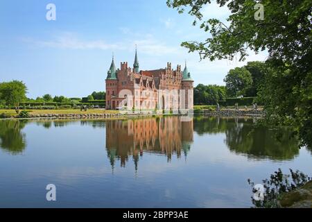 Egeskov Castle is located near Kvaerndrup, in the south of the island of Funen, Denmark. It is Europe's best preserved Renaissance water castle. Stock Photo