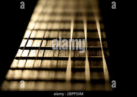 Closeup of the string instrument for classic rock pop isolated on black background. Stock Photo