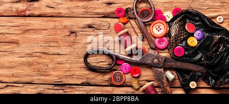 Spools of thread and basic sewing tools on wooden table.Sewing kit.Long banner Stock Photo