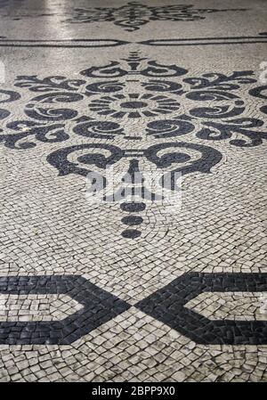 Typical stone floor Lisbon, detail of a typical floor with shapes and drawings, art Portugal, tourism Stock Photo