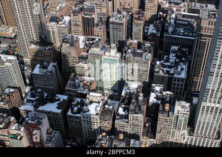 The shadow of Empire State Building on lesser skyscrapers in Midtown Manhattan, New York City, United States of America Stock Photo