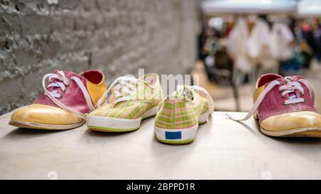 Vintage sneakers and saddle shoes for sale in a flea market in Manhattan Stock Photo