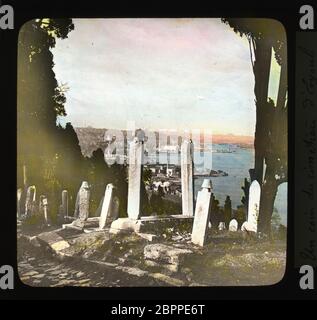Istanbul Constantinople: A corner of the cemetery of Eyoub (Eyüp) with a view of the Golden Horn and the city. Color (presumably hand colored) slide from around 1910. Photograph on dry glass plate from the Herry W. Schaefer collection. Stock Photo