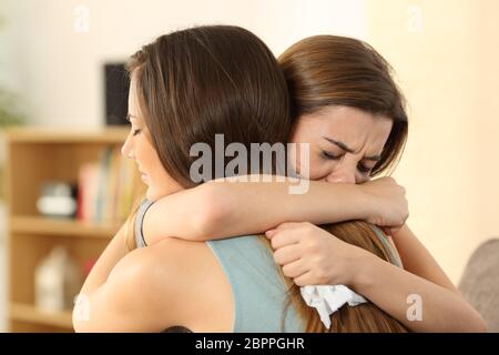 Girl Embracing To Comfort To Her Sad Best Friend After Break Up Stock Photo Alamy