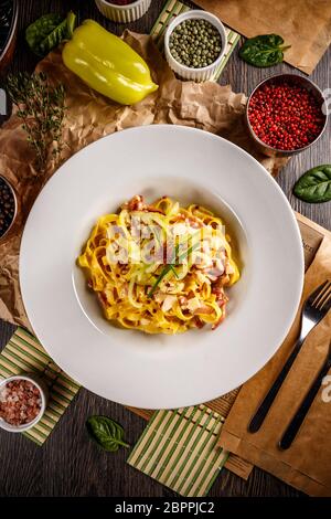 Pasta Carbonara with bacon and parmesan. Flat lay Stock Photo