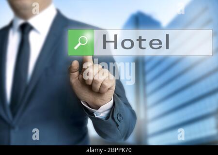 hotel browser is operated by businessman. Stock Photo